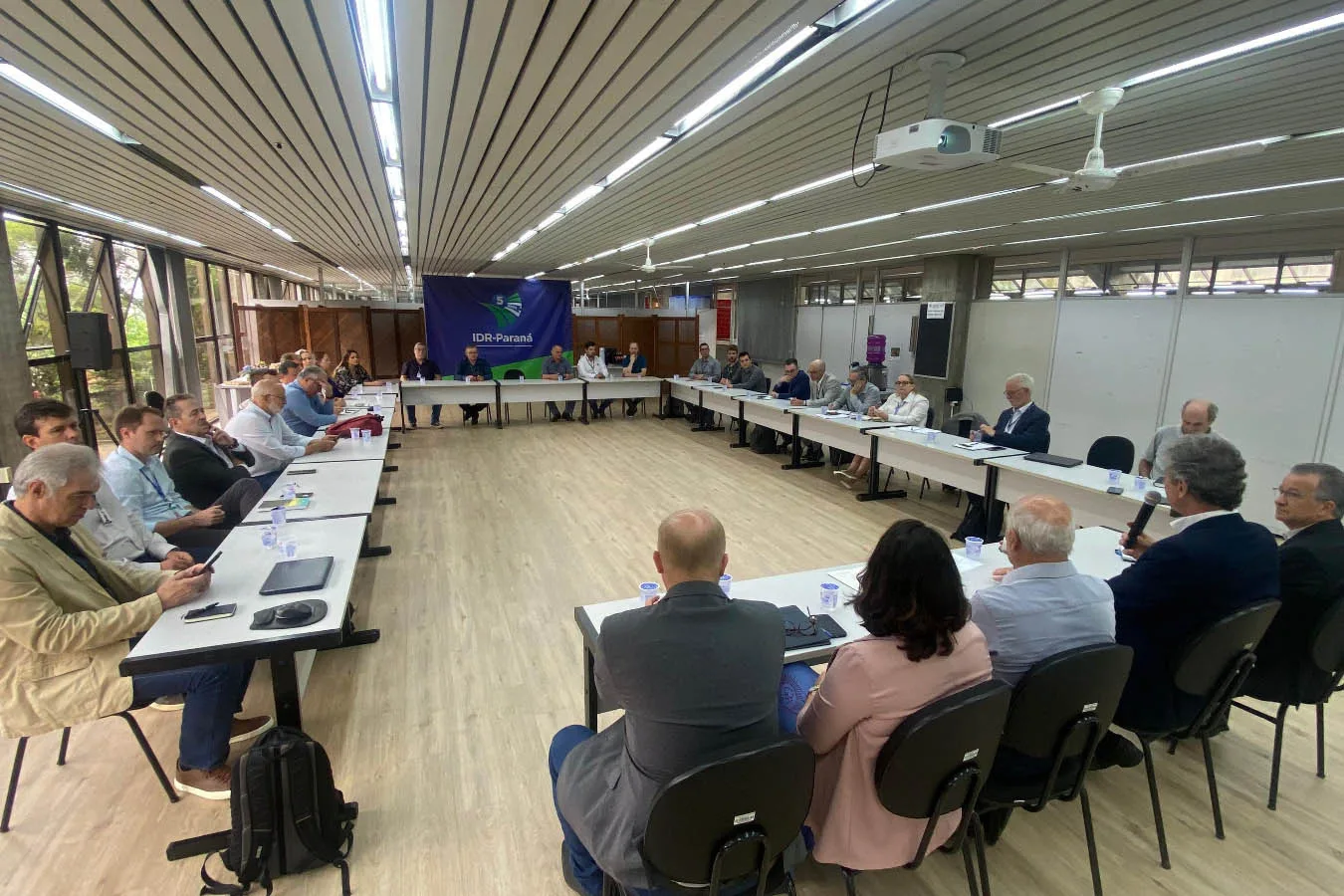 a group of people sitting at tables in a room